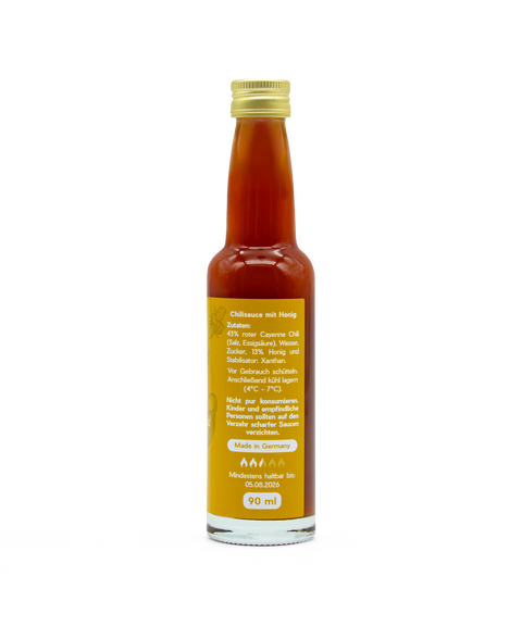 Honey Hot Sauce von FIVI – Scharfe Sauce und Honignote, auf der Flasche sind die Zutaten der Sauce zu lesen.